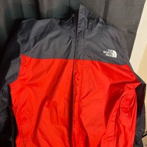 Red and black north face windbreaker